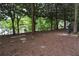 Spacious dog park features lush trees, green surroundings and lake in the background at 115 W Peachtree Nw Pl # 709, Atlanta, GA 30313