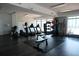 Bright gym featuring exercise equipment and floor to ceiling windows at 115 W Peachtree Nw Pl # 709, Atlanta, GA 30313