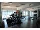 Gym featuring exercise equipment, a fireplace, and floor-to-ceiling windows at 115 W Peachtree Nw Pl # 709, Atlanta, GA 30313