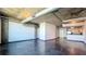 Large living space with industrial ceilings, exposed ductwork, and natural light at 115 W Peachtree Nw Pl # 709, Atlanta, GA 30313