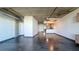 Living space with kitchen, exposed ductwork, and concrete ceilings at 115 W Peachtree Nw Pl # 709, Atlanta, GA 30313