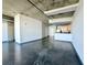 Bright open floor plan with concrete ceilings and floors and access to kitchen area at 115 W Peachtree Nw Pl # 709, Atlanta, GA 30313