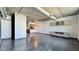 Open floor plan features concrete ceilings and floors, along with a spacious living area and modern fixtures at 115 W Peachtree Nw Pl # 709, Atlanta, GA 30313