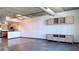 Open living space with modern cabinets, stainless steel appliances and concrete ceilings at 115 W Peachtree Nw Pl # 709, Atlanta, GA 30313