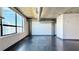 Bright living room with large windows and concrete ceilings at 115 W Peachtree Nw Pl # 709, Atlanta, GA 30313