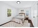 Charming bedroom with natural light, complemented by a neutral color scheme and hardwood floors at 2106 Penrose Dr, Atlanta, GA 30344