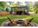 Back of the house with a wooden deck, stone firepit, and backyard at 2106 Penrose Dr, Atlanta, GA 30344