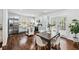 Open-concept kitchen and dining area with modern appliances, a center island, and stylish dining set at 2106 Penrose Dr, Atlanta, GA 30344