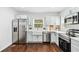 Modern kitchen featuring stainless steel appliances, light cabinets, and white countertops at 2106 Penrose Dr, Atlanta, GA 30344