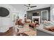 Stylish living room with a fireplace, hardwood floors, modern furniture, and plenty of natural light at 2106 Penrose Dr, Atlanta, GA 30344