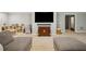 Finished basement is furnished with sectional sofa, shelving, and mounted television at 4555 Peachtree Dunwoody Rd, Sandy Springs, GA 30342