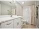 Bright bathroom with white vanity, modern fixtures, and a shower-tub combination with neutral tones at 4555 Peachtree Dunwoody Rd, Sandy Springs, GA 30342