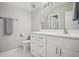 Updated bathroom showcases large mirror, clean vanity, and convenient towel rack at 4555 Peachtree Dunwoody Rd, Sandy Springs, GA 30342