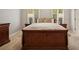 Comfortable bedroom has a plush bed with matching wood-finished nightstands and ample natural lighting at 4555 Peachtree Dunwoody Rd, Sandy Springs, GA 30342