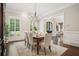Formal dining room featuring hardwood floors, and a view into the formal living space at 4555 Peachtree Dunwoody Rd, Sandy Springs, GA 30342