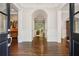 Elegant foyer with dark wood floors and arched doorways leading to other rooms at 4555 Peachtree Dunwoody Rd, Sandy Springs, GA 30342