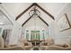 Spacious living area featuring vaulted ceilings, exposed beams, and large windows with natural light at 4555 Peachtree Dunwoody Rd, Sandy Springs, GA 30342