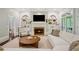 Spacious living room with built-in bookshelves and fireplace at 4555 Peachtree Dunwoody Rd, Sandy Springs, GA 30342