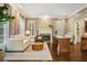 Cozy living room featuring a fireplace, hardwood floors, and neutral decor at 4555 Peachtree Dunwoody Rd, Sandy Springs, GA 30342