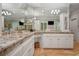 Bright main bathroom with dual sinks, granite counters, and ample mirror space at 4555 Peachtree Dunwoody Rd, Sandy Springs, GA 30342