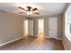 Open bedroom offering natural light and neutral colors with views to an ensuite bathroom at 4665 Jersey Walnut Grove Rd, Covington, GA 30014