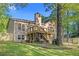 A multi tiered deck overlooks a spacious yard in the backyard at 4805 Forest Way Ct, Marietta, GA 30066