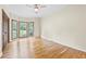 This bedroom boasts hardwood floors, a ceiling fan, a bay window and lush outdoors view at 4805 Forest Way Ct, Marietta, GA 30066