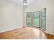 Dining area with hardwood floors, a chandelier, and bay windows with scenic views at 4805 Forest Way Ct, Marietta, GA 30066