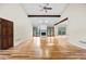 Open living room features a fireplace, wood beams, hardwood floors, and lots of natural light at 4805 Forest Way Ct, Marietta, GA 30066