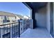 Outdoor balcony with black railing overlooking neighborhood rooftops and blue sky at 606 Broadview Ne Ter, Atlanta, GA 30324