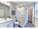 Bathroom features a glass-enclosed shower, modern vanity, and a walk-in closet at 606 Broadview Ne Ter, Atlanta, GA 30324