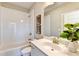 Bathroom features a tub-shower combo, white vanity, and stylish decor at 606 Broadview Ne Ter, Atlanta, GA 30324