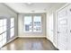 Sun-lit bedroom with hardwood floors, two bright windows, and classic white doors at 606 Broadview Ne Ter, Atlanta, GA 30324
