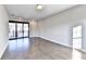 Open concept bedroom with hardwood floors and sliding glass door to the balcony at 606 Broadview Ne Ter, Atlanta, GA 30324