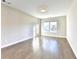 Bright, empty bedroom with wood floors, neutral walls, and lots of natural light at 606 Broadview Ne Ter, Atlanta, GA 30324