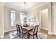 Cozy dining room with hardwood floors, floral artwork and a wooden table that seats six at 606 Broadview Ne Ter, Atlanta, GA 30324