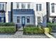 Beautiful townhome exterior with brick accents, manicured landscaping, and inviting entrance at 606 Broadview Ne Ter, Atlanta, GA 30324