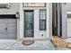 Charming front entryway with decorative front door and welcome mat at 606 Broadview Ne Ter, Atlanta, GA 30324