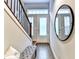 Hallway with staircase, hardwood floors and front door with glass insert at 606 Broadview Ne Ter, Atlanta, GA 30324