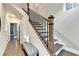 Hallway with hardwood floors and staircase featuring decorative wood banisters at 606 Broadview Ne Ter, Atlanta, GA 30324