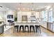 Bright kitchen featuring stainless steel appliances, island with seating, modern lighting and hardwood floors at 606 Broadview Ne Ter, Atlanta, GA 30324