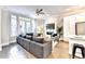 Living room open to kitchen with hardwood floors and balcony access at 606 Broadview Ne Ter, Atlanta, GA 30324