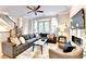 Bright living room with hardwood floors, comfortable seating, and a ceiling fan at 606 Broadview Ne Ter, Atlanta, GA 30324