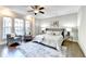 Relaxing main bedroom with hardwood floors, comfortable seating and a ceiling fan at 606 Broadview Ne Ter, Atlanta, GA 30324