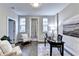 Charming home office features light gray walls, hardwood flooring, and a cozy sitting area at 606 Broadview Ne Ter, Atlanta, GA 30324