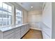 Spacious walk-in closet with custom shelving, drawers, and bright natural light at 606 Broadview Ne Ter, Atlanta, GA 30324