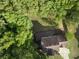 Overhead view highlighting the house layout amidst mature trees, showcasing the private setting at 731 Sacketts Ct, Lawrenceville, GA 30043