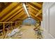 Unfinished attic space with exposed wood beams, offering potential for customization and expansion at 731 Sacketts Ct, Lawrenceville, GA 30043