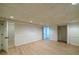 Spacious finished basement featuring wood floors, neutral paint and access to additional rooms at 731 Sacketts Ct, Lawrenceville, GA 30043