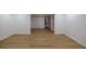 Large finished basement area featuring new laminate floors, white walls and trim at 731 Sacketts Ct, Lawrenceville, GA 30043